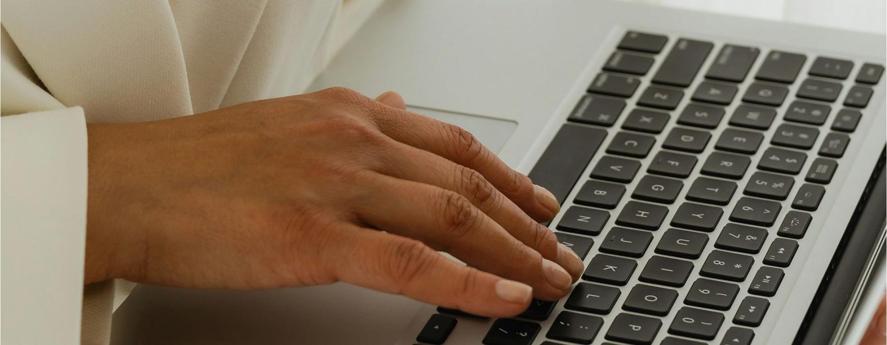a person typing on a laptop