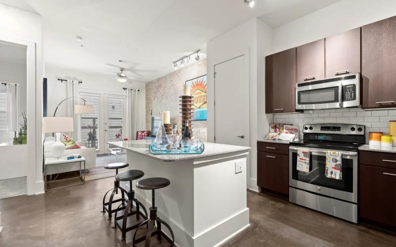 a kitchen with black appliances